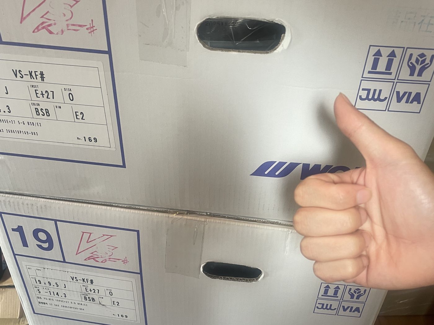 Boxes of new WORK wheels and a thumbs-up
