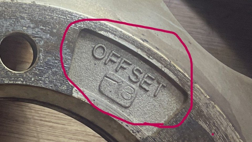 The offset stamp on the back of a wheel: −13, circled in red