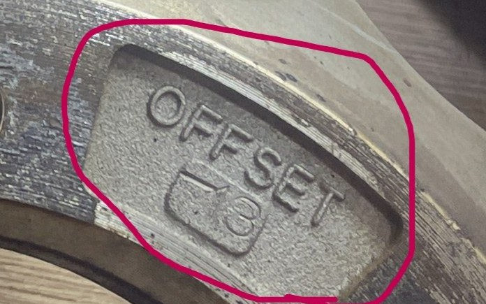 The stamp on the back of the wheel: −13 under OFFSET, circled in red